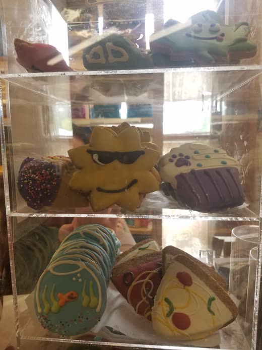 Decorated novelty dog biscuits in a perspex counter case
